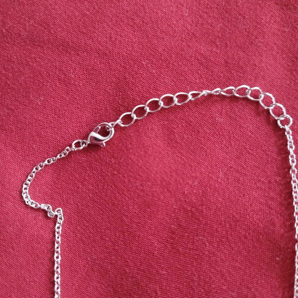 Silver colored necklace with palm tree - Picture 4 of 6